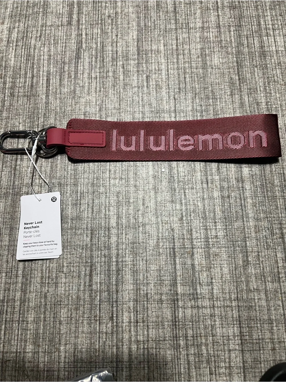 lululemon athletica Never Lost key strap in burgundy with logo